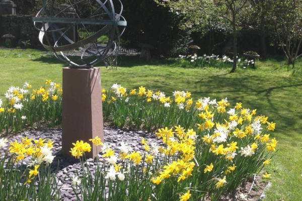 Bronze-Armillary-80cm-surrounded-by-daffodils-600x400 Bronze