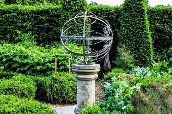 Bronze-Armillary-on-a-weathered-Doric-plinth-in-a-herb-garden-scaled-600x400 Bronze