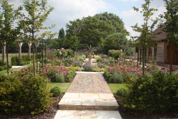 Large-Brass-Armillary-as-the-centre-piece-of-this-rose-garden-scaled-600x400 Brass