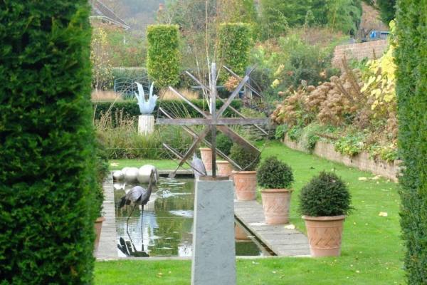 Looking-through-the-Yew-hedge-this-Bronze-Armillary-blends-beautifully-with-the-Autumn-colours-600x400 Bronze